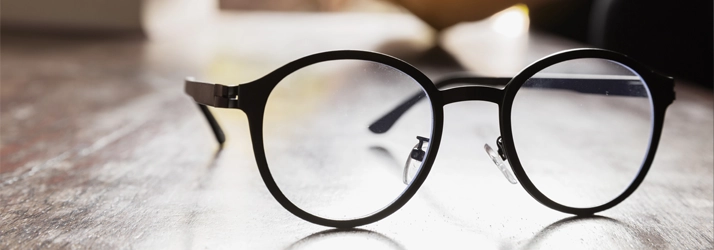 Eye Doctor Cape Girardeau MO Glasses A pair of black glasses sitting on a table.