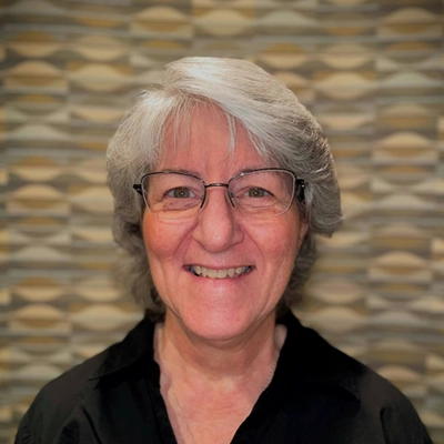 MaryLou McClearn smiling in a black shirt.